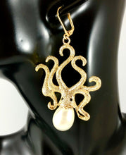 Load image into Gallery viewer, Enlarged picture of Texture Octopus with Pearl Accent Dangle Earrings Color: Gold/White Approx. 2.8&quot; Length x 1.5&quot; Width Lever Back