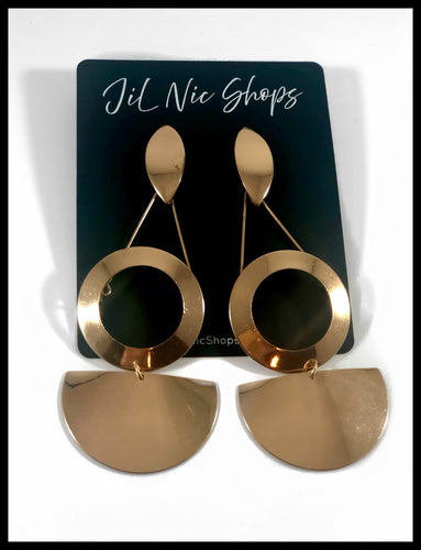 Gold three tier geo shaped long dangle earrings. First tier is oblong oval shape that is connected to the second tier which is a circle. The third tier is a half circle shape. It is a post back earring.