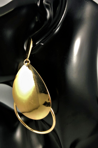 Magnified image of a Gold double teardrop open drop earrings. Approximately 3.5" Length x 2" Width, with a post back.